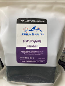 Bag of Signature olive and coconut oil soap scrappies with charcoal