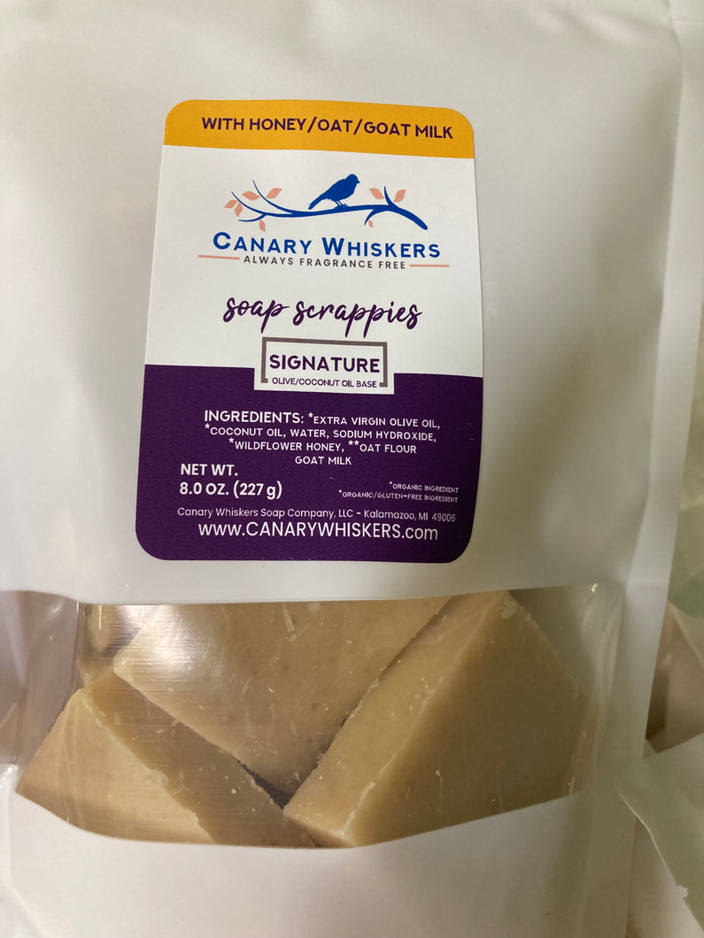 Bag of scrappies Signature olive and coconut oil soap with honey, oats, and goat milk.